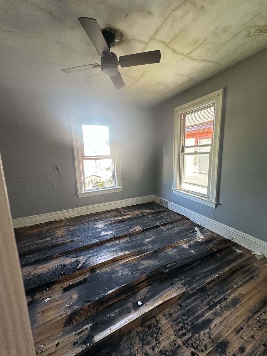 Charred hardwood flooring from fire damage