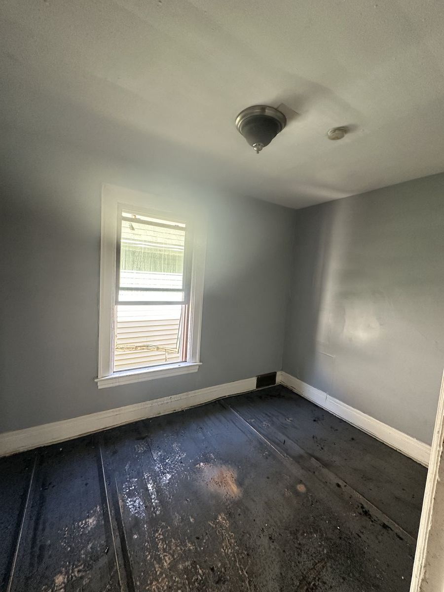 Bedroom with extensive damage requiring full restoration